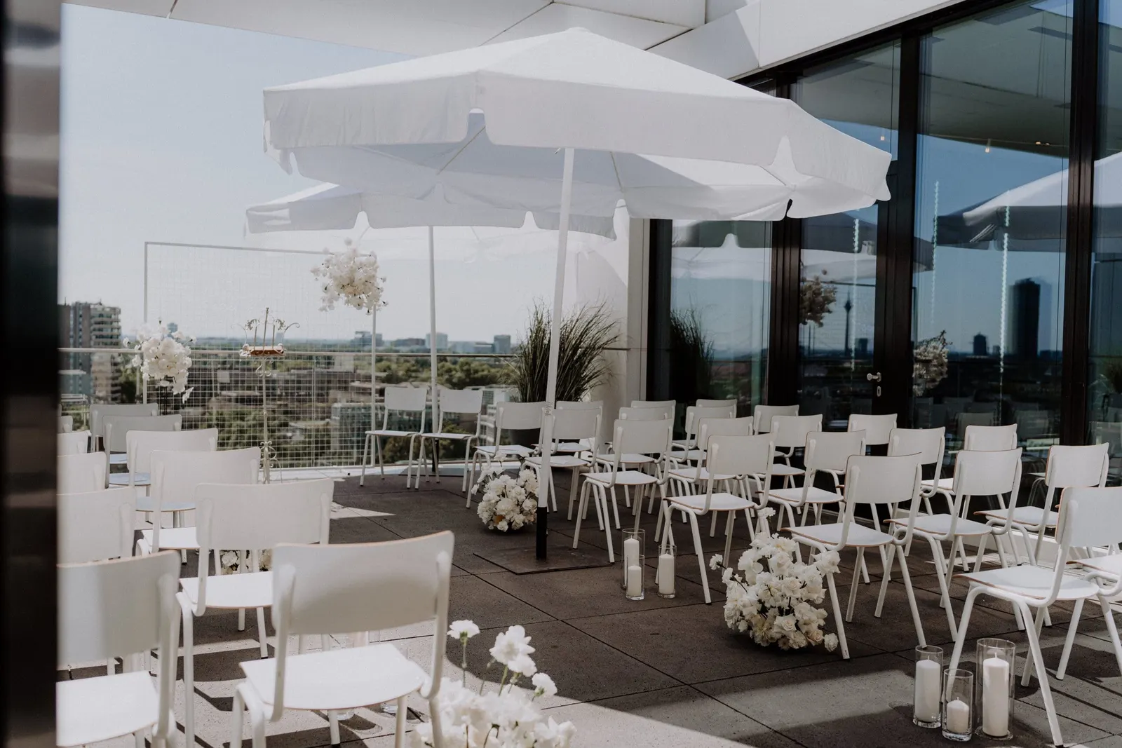 Terrace with umbrellas and wedding seating in Düsseldorf